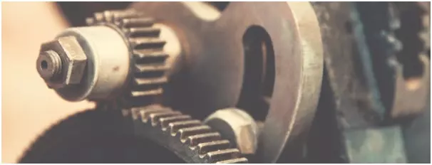 Close-up of cogwheels illustrating our detailed understanding of consulting cover letters.