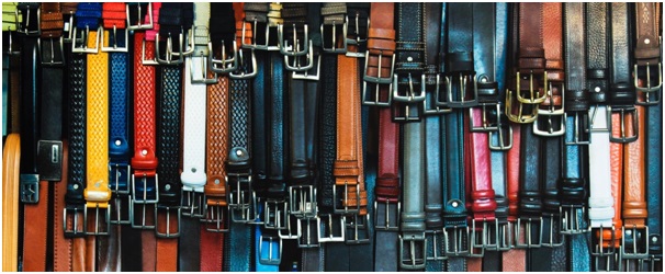 Rack of belts illustrating a worked example PST question concerning two menswear companies