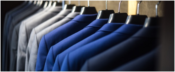 Rail of suits in shades of blue and grey